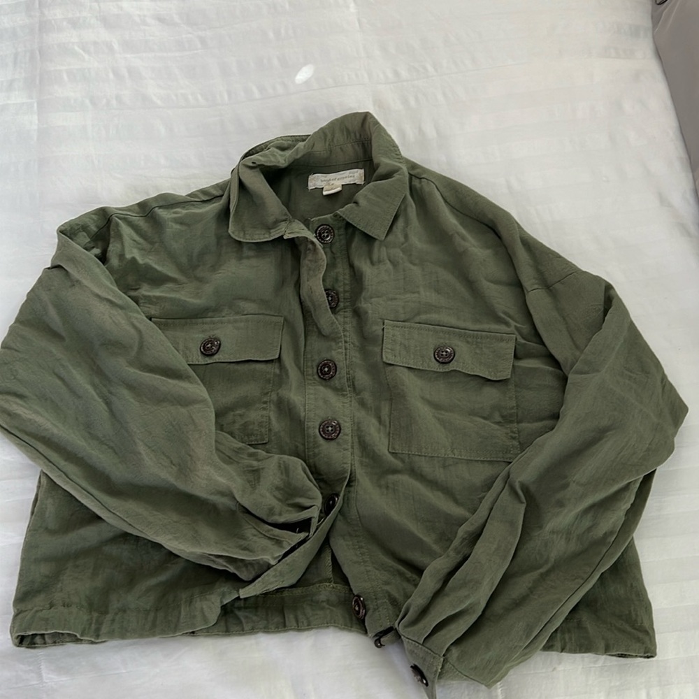Green button up shirt